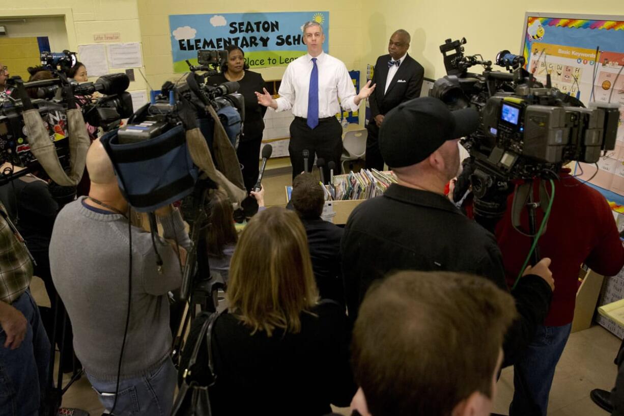 Education Secretary Arne Duncan answers questions after speaking about the administration's priorities for education Monday at Seaton Elementary in Washington.