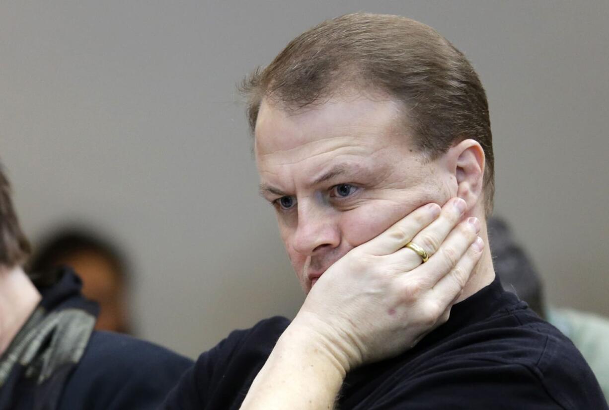 Initiative promoter Tim Eyman waits for his turn to speak before the Senate Ways and Means Committee on Feb. 9 at the state Capitol in Olympia.