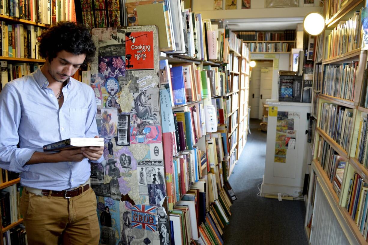 Marco P. Cremasco, 28, of Sao Paulo, Brazil, browses through Downtown Books, located on the iconic Route 66 in Albuquerque, N.M. Route 66 is home to a number of bookstores, often attracting regulars from around the corner and visitors from around the world.