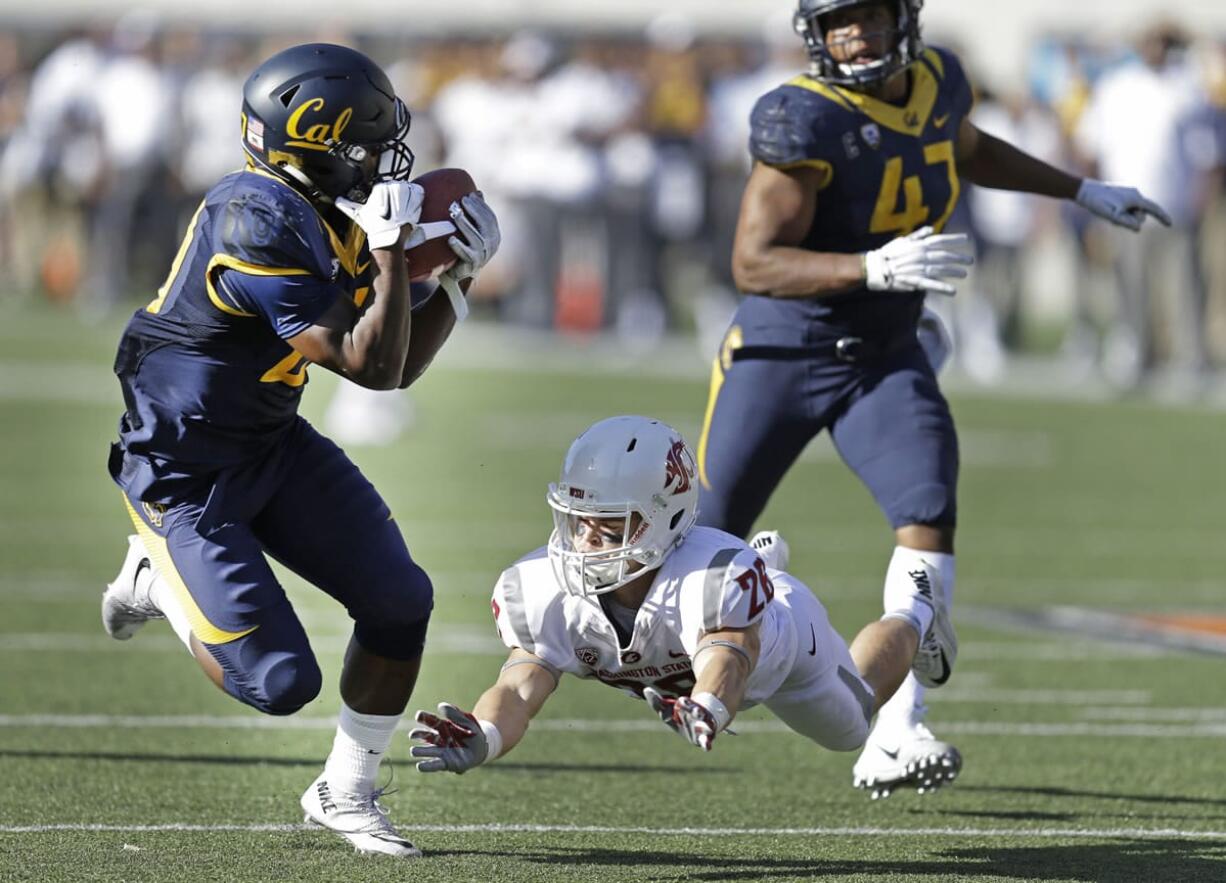 California&#039;s Damariay Drew, left, intercepts a pass intended for Washington State&#039;s Tyler Baker (26) during the second half of an NCAA college football game Saturday, Oct. 3, 2015, in Berkeley, Calif. California won the game 34-28. At right is California&#039;s Hardy Nickerson.