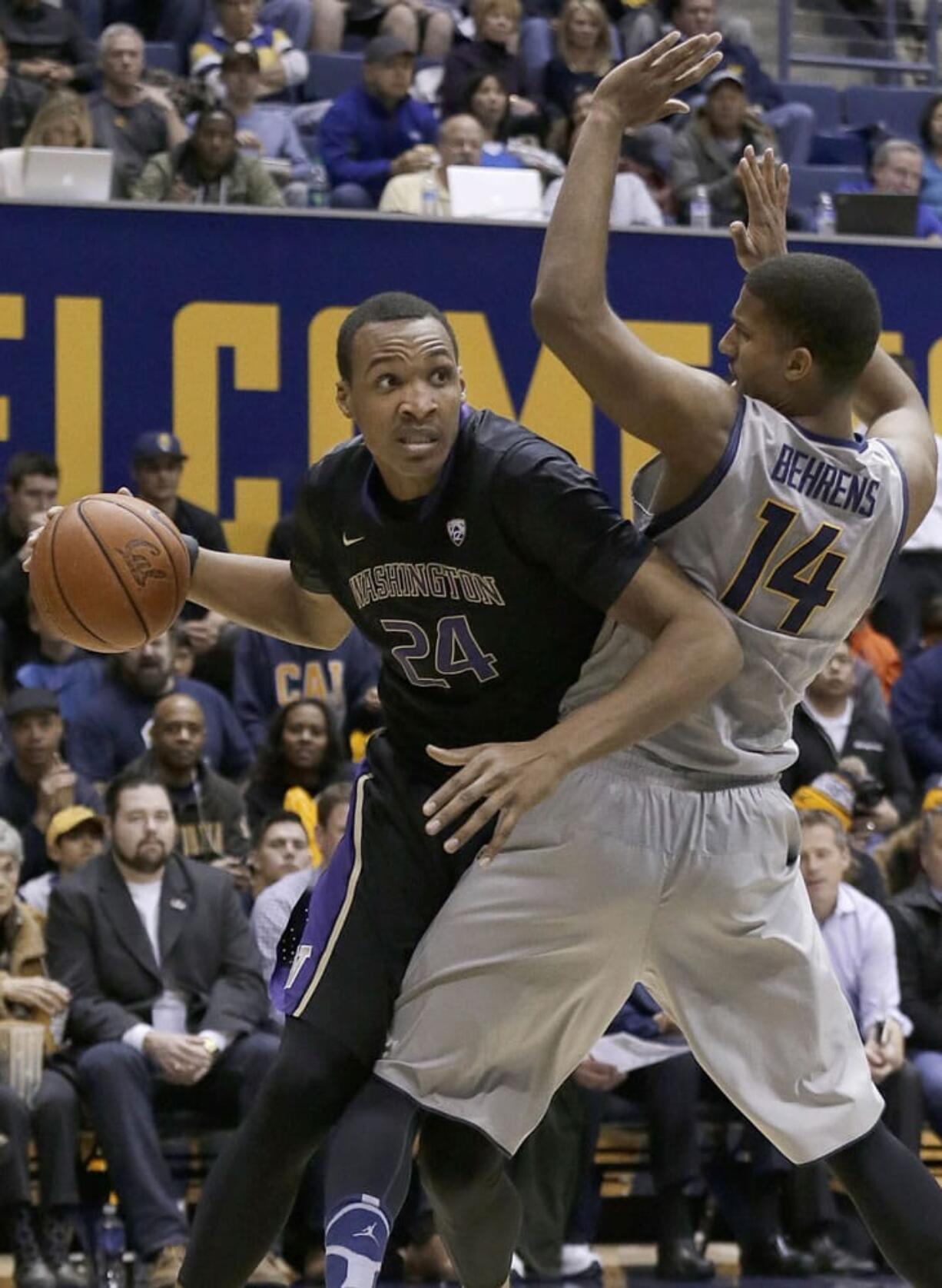 Washington center Robert Upshaw (24) drives against California forward Christian Behrens (14) during the first half in Berkeley, Calif., Friday, Jan. 2, 2015.