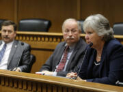 Senate Minority Leader Sharon Nelson, D-Maury Island, right, speaks Thursday during the leadership panel of the annual Associated Press legislative preview in Olympia as Senate Majority Leader Mark Schoesler, R-Ritzville, left, and House Speaker Frank Chopp, D-Seattle, center, look on.