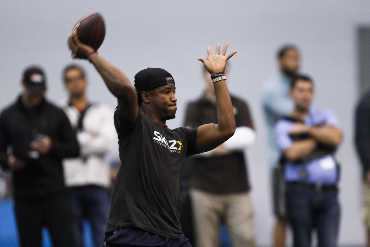 Washington quarterback Keith Price passes during the NFL football pro day at the Dempsey Indoor Practice Facility Wednesday, April 2, 2014, in Seattle.