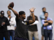 Washington quarterback Keith Price passes during the NFL football pro day at the Dempsey Indoor Practice Facility Wednesday, April 2, 2014, in Seattle.