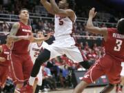 Stanford guard Chasson Randle (5) takes a shot over Washington State center Jordan Railey, left, during the second half Friday, Jan. 2, 2015, in Stanford, Calif. Stanford won 71-56.