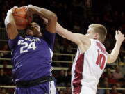 Washington center Robert Upshaw, left, tries to shoot as Stanford forward Michael Humphrey defends during the first half Sunday, Jan. 4, 2015, in Stanford, Calif.