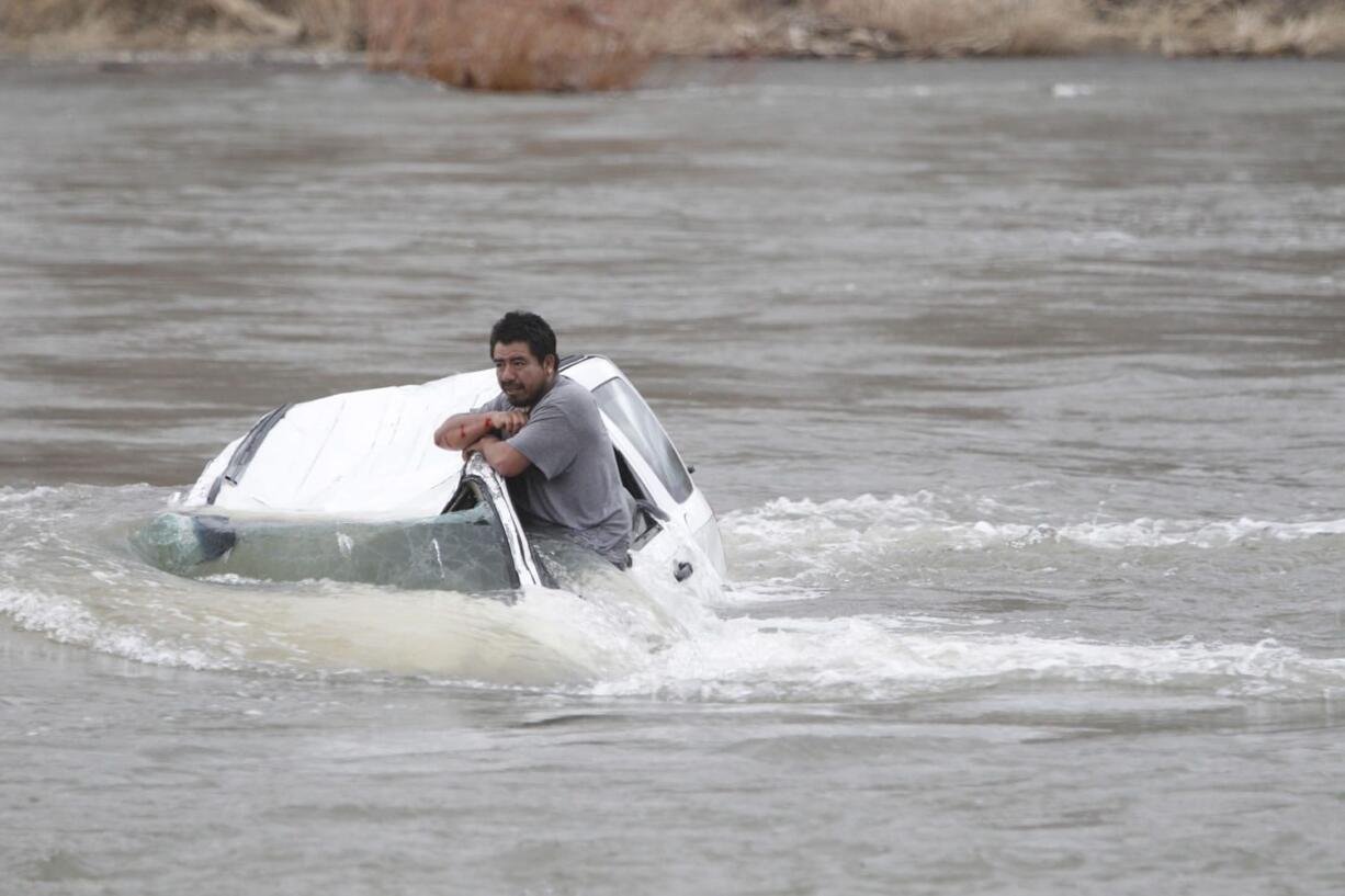 A man stranded in his car in the Yakima River in Wapato on Sunday.