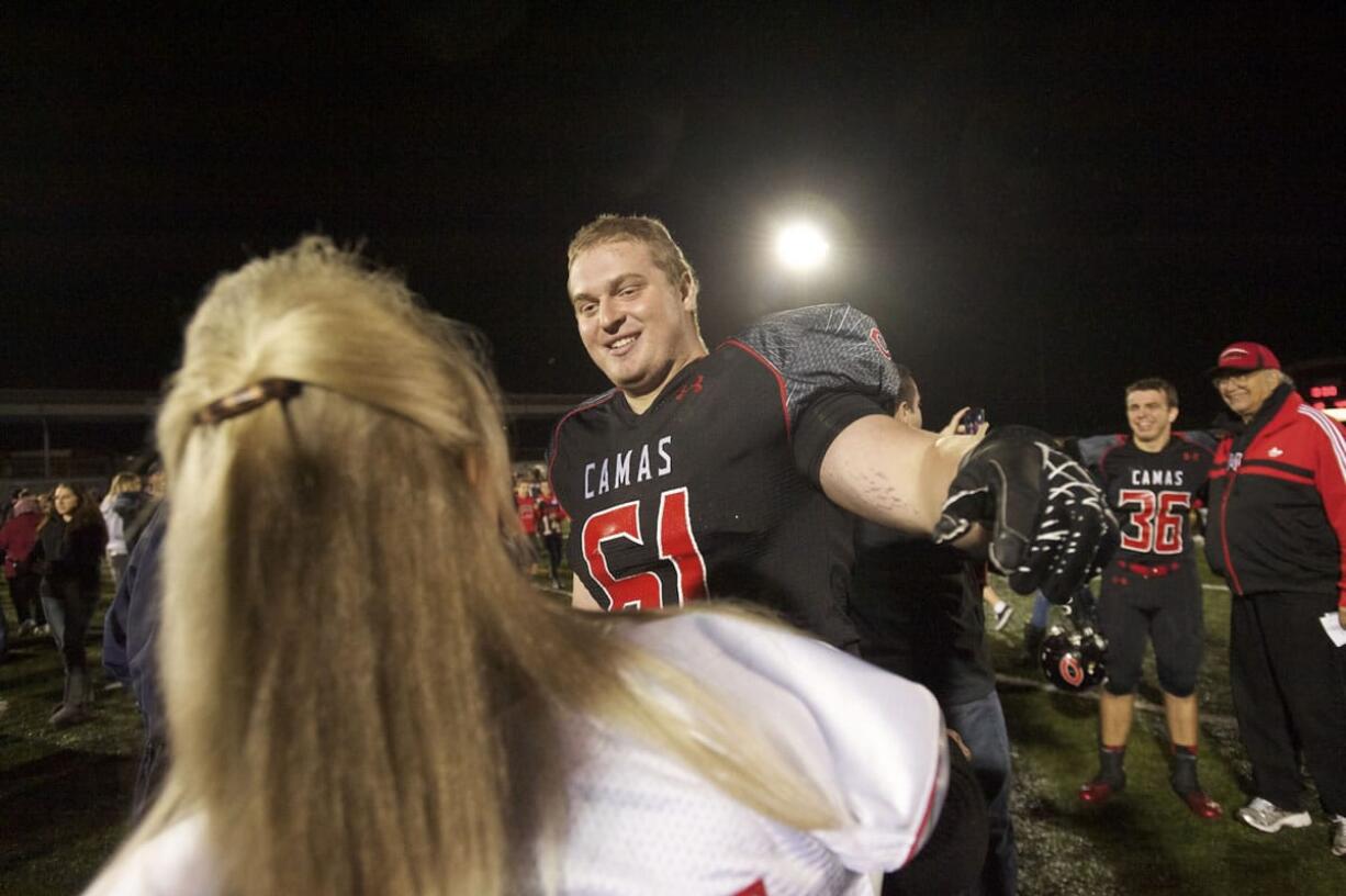 Drew Clarkson finds his mother after the game against Lakes, September 27, 2013. Camas beats Lakes 49-0.