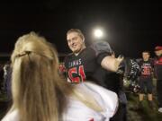 Drew Clarkson finds his mother after the game against Lakes, September 27, 2013. Camas beats Lakes 49-0.