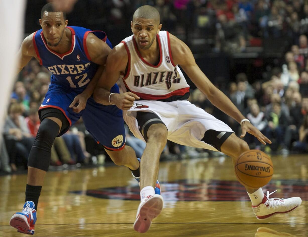 Portland Trail Blazers Nicolas Batum handles the ball against the Philadelphia 76ers, Saturday, January 4, 2014.