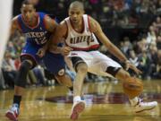 Portland Trail Blazers Nicolas Batum handles the ball against the Philadelphia 76ers, Saturday, January 4, 2014.