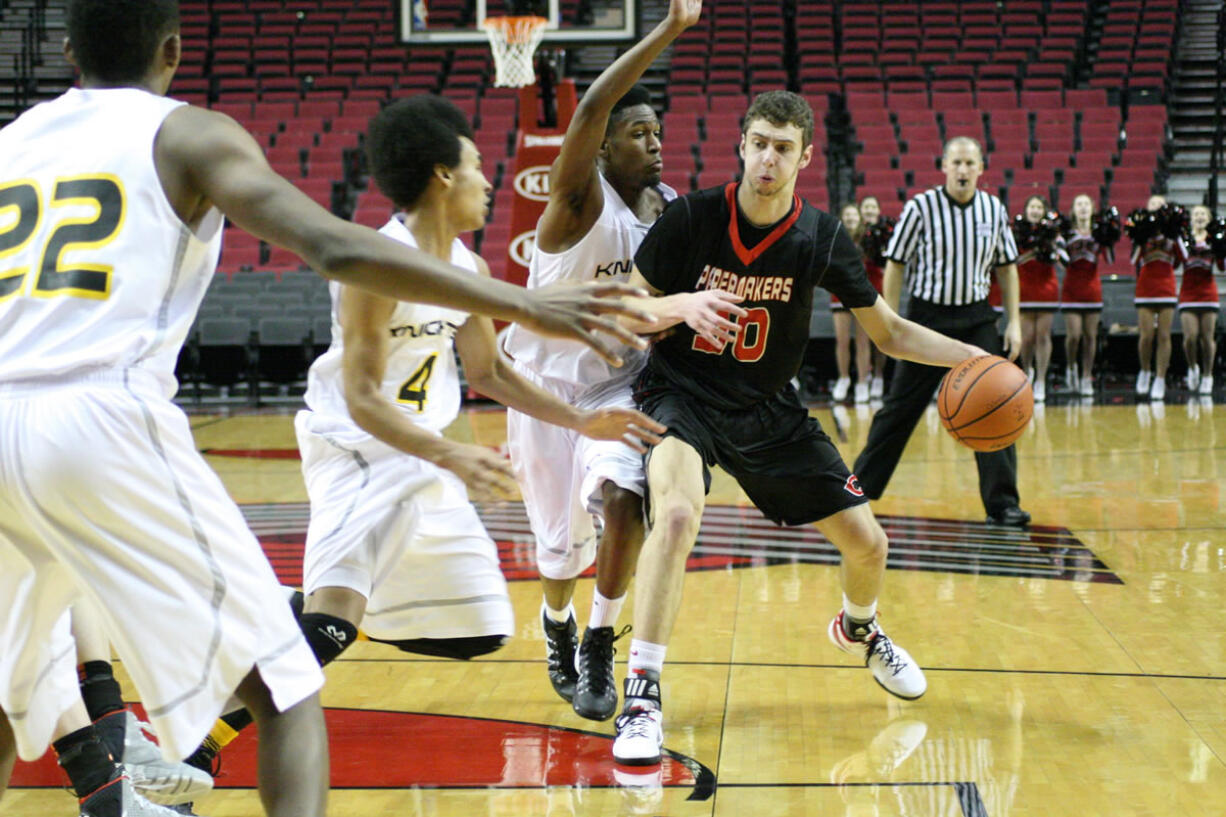 Trevor Jasinsky drives toward the basket during a game held at the Moda Center in Portland against Columbia Christian of Portland. The Papermaker had 10 points in what ended in a loss for Camas, 76-50.