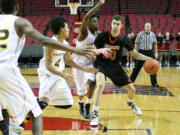 Trevor Jasinsky drives toward the basket during a game held at the Moda Center in Portland against Columbia Christian of Portland. The Papermaker had 10 points in what ended in a loss for Camas, 76-50.