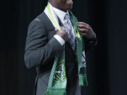 Schillo Tshuma walks on stage after being selected by Portland Timbers in the first round of the 2014 Major League Soccer SuperDraft, Thursday, Jan. 16, 2014, in Philadelphia.