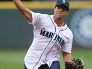 Seattle Seahawks quarterback Russell Wilson throws out the ceremonial first pitch before a Mariners game on June 7, 2013.