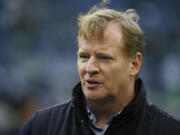 NFL commissioner Roger Goodell walks on the field before the NFL football NFC Championship game between the Seattle Seahawks and the San Francisco 49ers Sunday, Jan. 19, 2014, in Seattle.