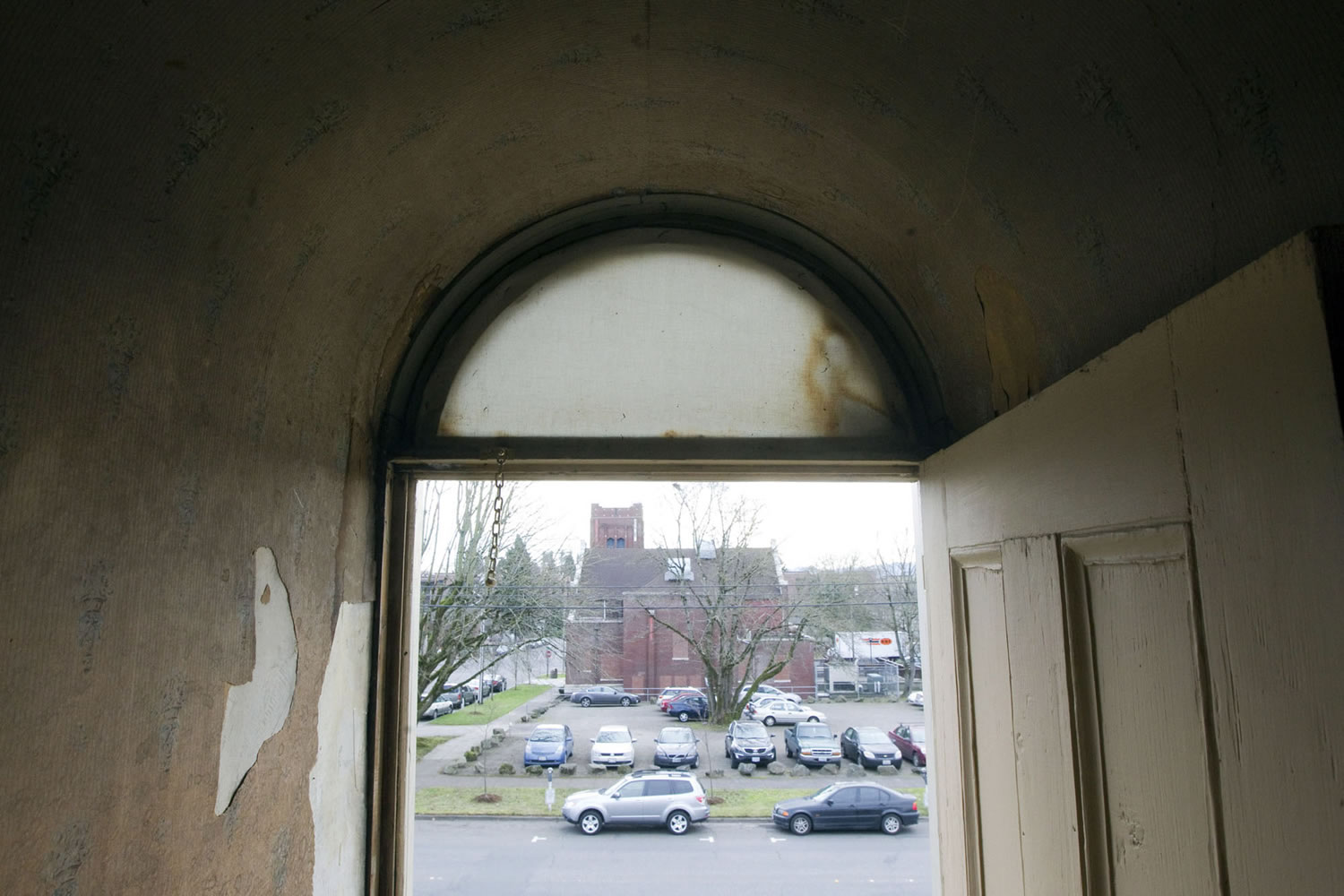 A doorway on the second story of the Charles Brown House opens to nothing but a view of downtown Vancouver.