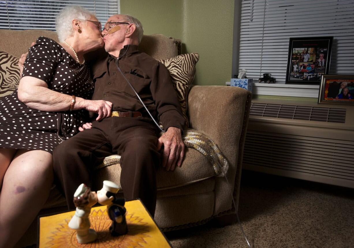 Donna Higgins and George Bennett share a smooch, following the example of the nurse and sailor figures in the foreground.