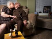 Donna Higgins and George Bennett share a smooch, following the example of the nurse and sailor figures in the foreground.