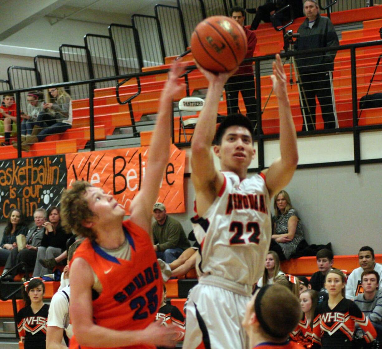 Austin Tran nets two of his 27 points for the Panthers Jan. 28, at Washougal High School.