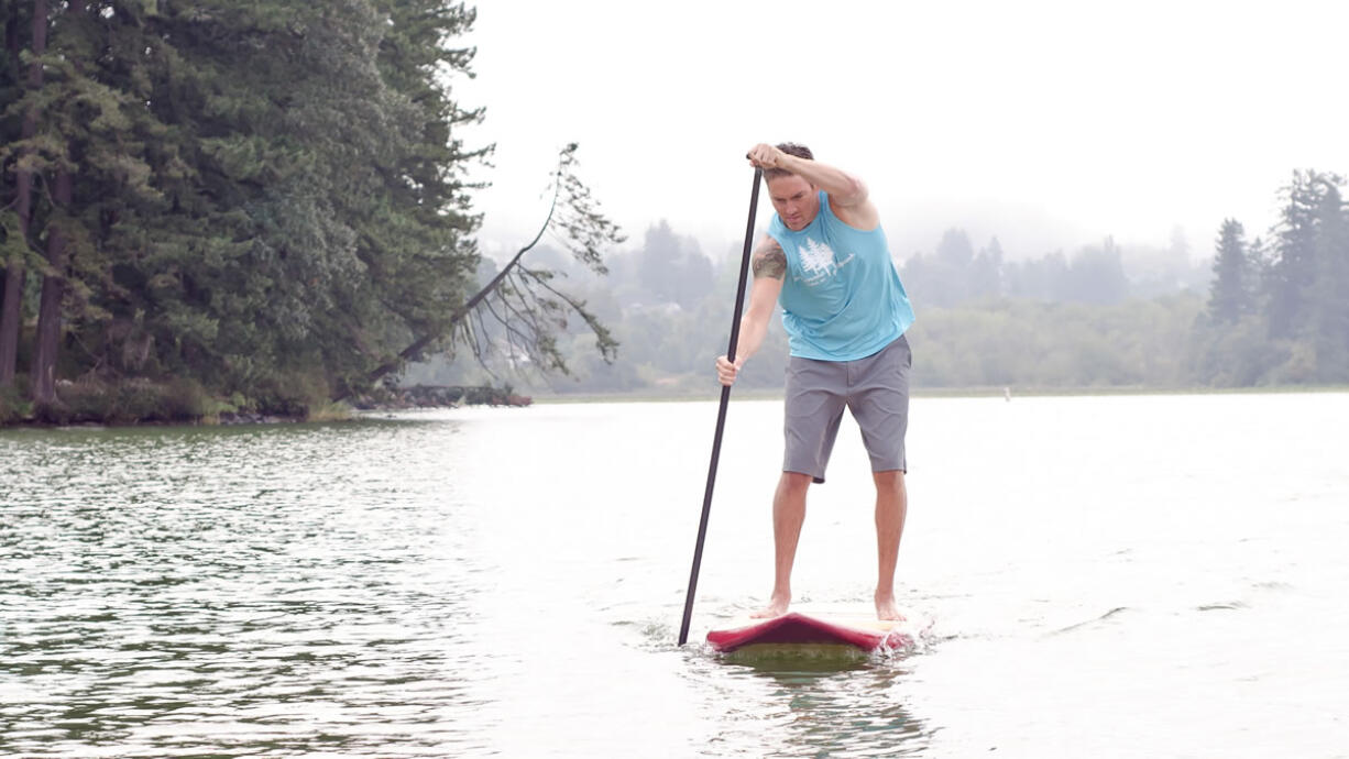 Travis Fuhrer takes a Sweetwood Paddleboard for a spin at Lacamas Lake. This is just a taste of the activities in store for the World Paddleboard Association's Salmon Classic Aug.