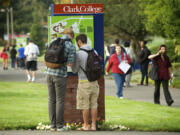 Students look over a campus map on their way to journalism class on the first day of school at Clark College in September 2012.