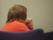 Twelve-year-old Quincy Tuttle sits in court in January.