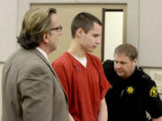 Colton Harris-Moore arrives in Skagit County Superior Court in Mount Vernon, Wash., on Thursday, Feb. 28, 2013, with his defense lawyer John Henry Browne.  Harris-Moore faces arraignment on a new second-degree burglary charge for the February 2010 break-in at the Anacortes airport where he stole a plane. Prosecutor Richard Weyrich also wanted to charge Harris-Moore with the theft of the plane, but he already pleaded guilty to that on a charge from San Juan County where the plane landed. Harris-Moore has acknowledged dozens of crimes from Washington to the Bahamas where he was arrested in July 2010.
