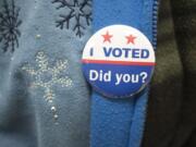 A voter wears an &quot;I Voted&quot; pin at Gaiser Hall, Clark College, on Tuesday in Vancouver.