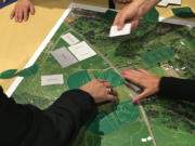 Ridgefield residents rearrange fields and buildings on an interactive map of a proposed outdoor recreation complex Thursday night.