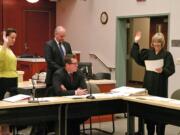 Clark County Superior Court Judge Barbara Johnson, right, swears in state Sen.