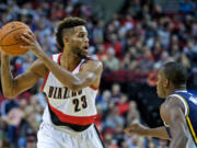 Portland&#039;s Allen Crabbe, left, does not attend the Blazers chapel service, but prefers an internet connection so he can see his family&#039;s service from Los Angeles.