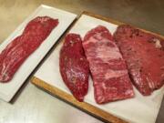 Flatiron/Backyard, from left, Teres Major, Boneless Chuck Flat and Top Sirloin Culotte cuts are readied on the kitchen table Oct.