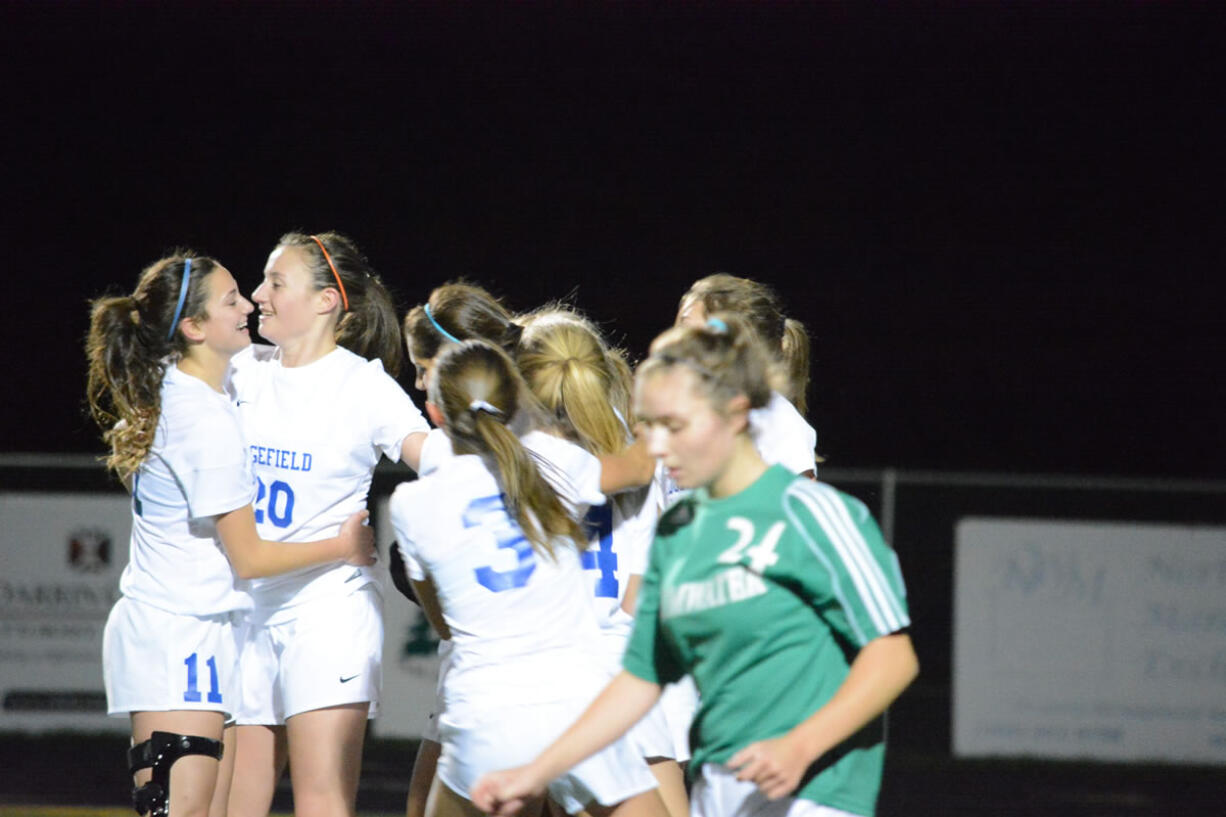 Ridgefield celebrates Madison Ochoa&#039;s goal in the first half of a Class 2A District 4 semifinal soccer match against Tumwater on Tuesday at Ridgefield High School. Ridgefield won 4-0.