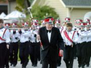 Ed Lynch leads the Fort Vancouver High School marching band into Esther Short Park during a community celebration in 2005.