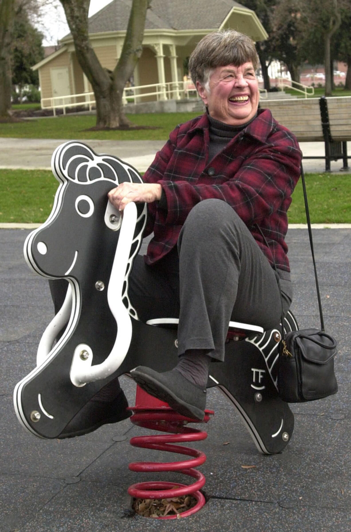 Florence Wager, one of the founders of the Parks and Recreation Foundation, enjoys the playground at Esther Short Park in a 2001 photo.