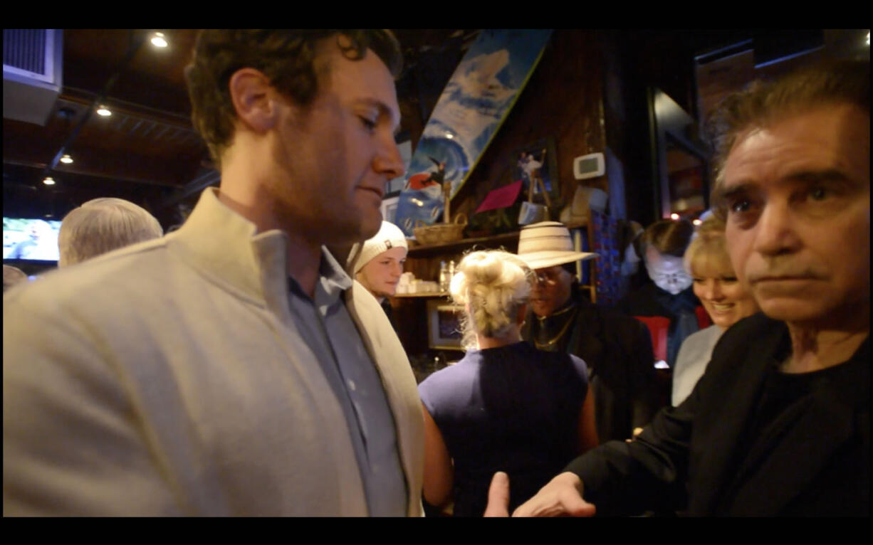 Vancouver Mayor Tim Leavitt, left, speaks Tuesday with Columbian Editor Lou Brancaccio at Beaches right after election results were released.