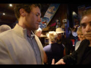 Vancouver Mayor Tim Leavitt, left, speaks Tuesday with Columbian Editor Lou Brancaccio at Beaches right after election results were released.