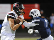 Camas player Laim Fitzgerald (L) is challenged by Skyview player Olive Emmy for the ball during the two team's first meeting in October.