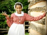 Azie Dungey portrays Lizzie Mae, a housemaid on George Washington's estate, in the Web series &quot;Ask a Slave.&quot;