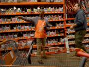 Military veteran Donald Sullivan, left, helps customer David Scannell on Oct.