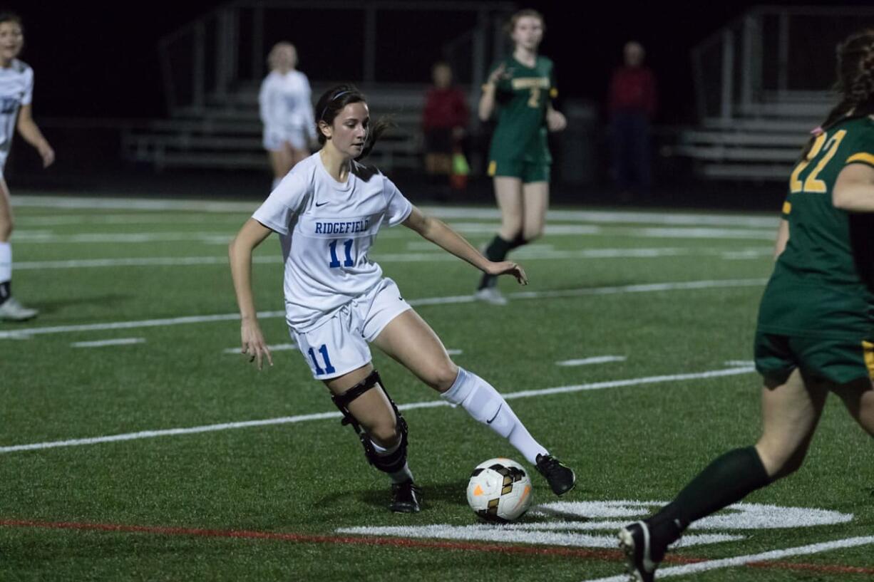 Ridgefield senior Riley Smetzler dribbles the ball in a 2A state playoff soccer match Saturday against Shorecrest. The 2A Greater St. Helens League Defensive MVP missed her junior year after suffering a knee injury at the beginning of the season.