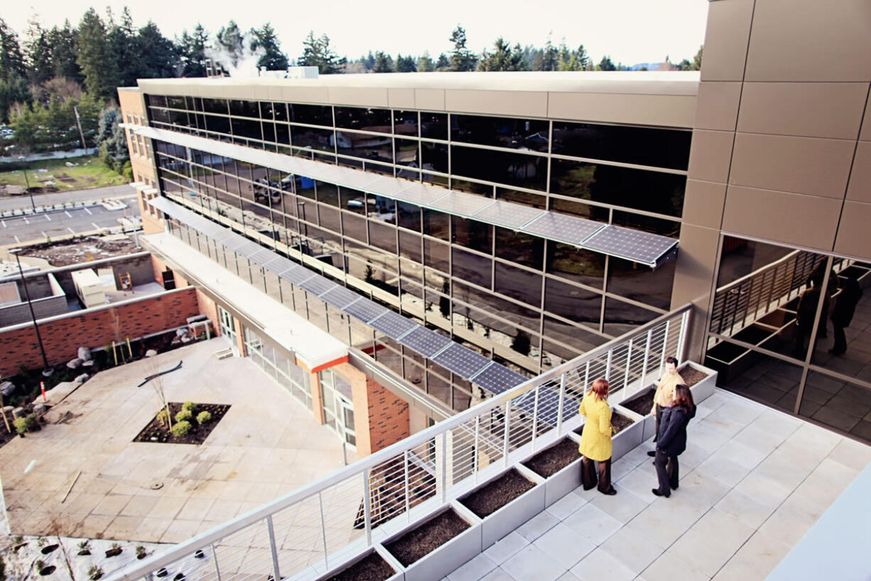 Awning-style photovoltaic arrays that not only produce solar energy but also provide shade to cut down on cooling costs on sunny days are shown at Henrietta Lacks Health and Bioscience High School in Vancouver.