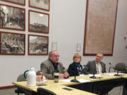 Clark County Councilors, from left, Tom Mielke, Jeanne Stewart and David Madore discuss adding the words &quot;In God We Trust&quot; to a hearing room wall last February. Though a Christian, Stewart voted no, citing the idea&#039;s divisiveness.