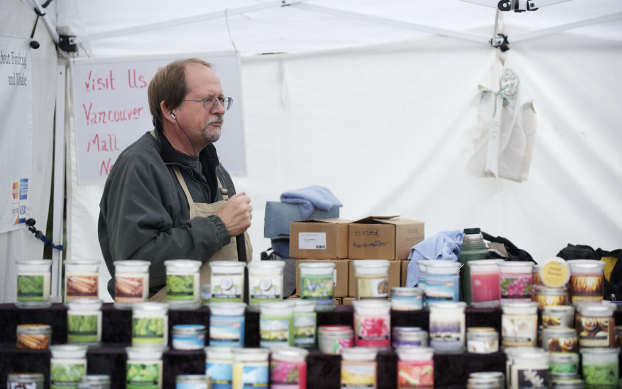 Steven Lane/Columbian files
Steve Wildman, from Candeo Candles, works at the Vancouver Farmers Market in 2012.