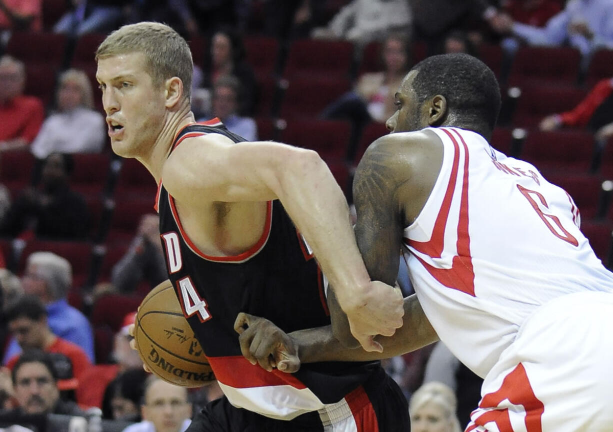 Portland Trail Blazers&#039; Mason Plumlee (24) tries to fend off Houston Rockets&#039; Terrence Jones (6) in the first half of an NBA basketball game Wednesday, Nov. 18, 2015, in Houston.