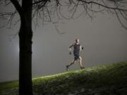 Austin Blankenship of Columbia River High School runs near Bliss Road last week in Vancouver.