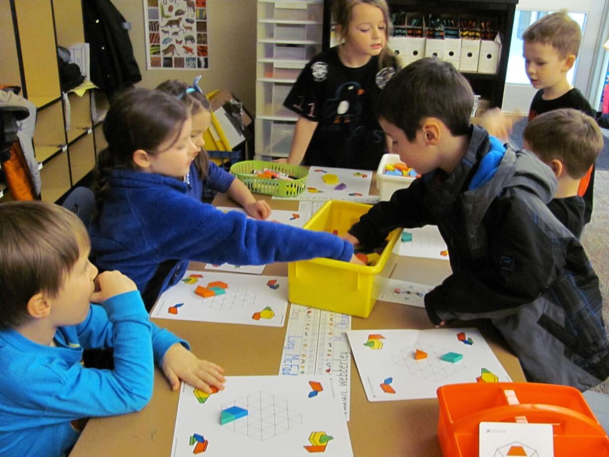 Students work on improving their math skills with hands-on activities.