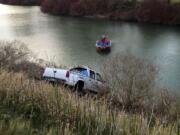 A cable was attached to the submerged pickup, which was pulled out of the water and impounded by the Cowlitz County Sheriff's Office.