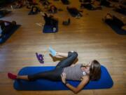 Karen Oliveri leads a stretching class at the Biggest Loser Resort at Fitness Ridge in Malibu, Calif., on Nov.